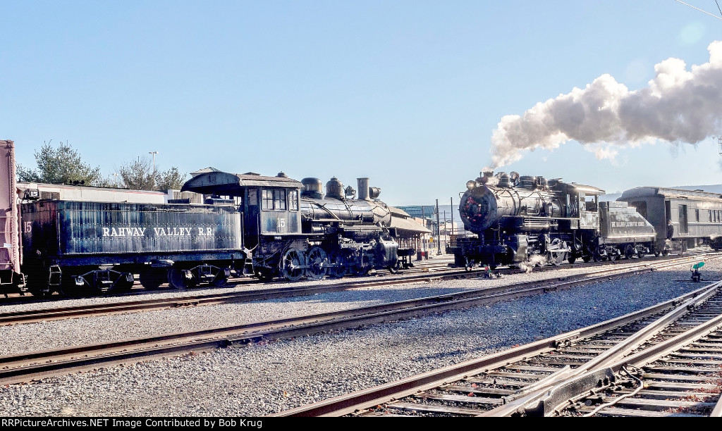 BLW 26 at the head of the Santa train passes Rahway Valley steam locomotive 15 in the Steamtown yard.